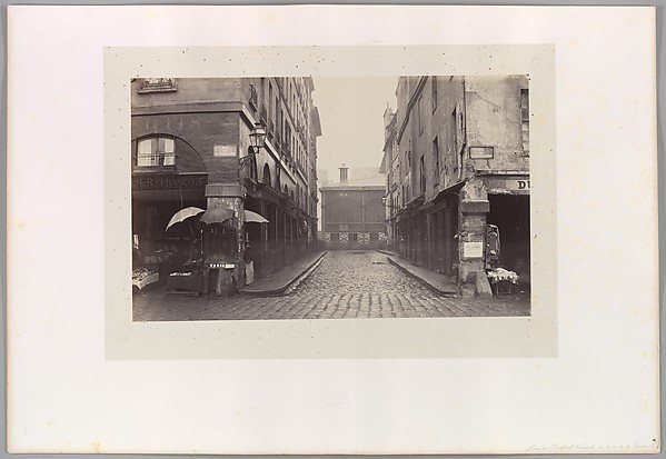 Rue du Contrat-Social, de la rue de la Tonnellerie, Charles Marville, 1864-1865. The Met, public domain.
